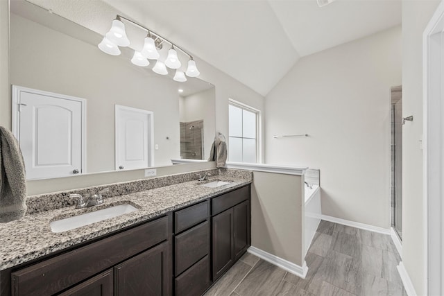 3009 Gilchrist Dr, Lorena, TX 76655 - full bath with a shower stall, a bath, double vanity, vaulted ceiling, and baseboards
