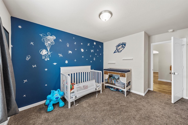 3009 Gilchrist Dr, Lorena, TX 76655 - carpeted bedroom featuring baseboards and a nursery area