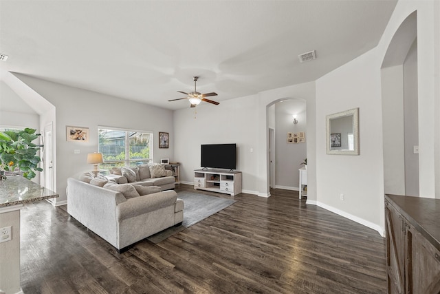 3009 Gilchrist Dr, Lorena, TX 76655 - living area featuring arched walkways, a ceiling fan, dark wood-type flooring, and baseboards