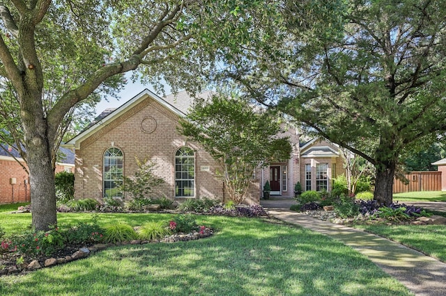 1507 Glade Point Dr, Coppell, TX 75019 - view of front facade featuring brick siding and a front lawn