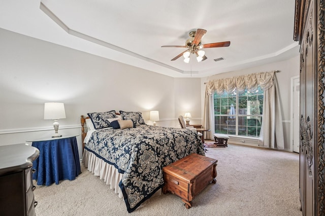 1507 Glade Point Dr, Coppell, TX 75019 - carpeted bedroom featuring a tray ceiling and ceiling fan