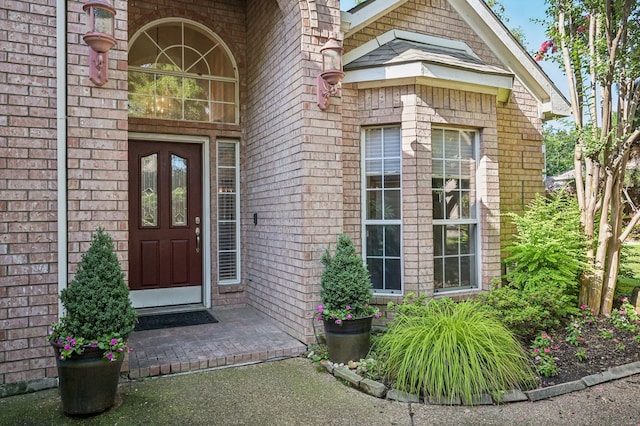 1507 Glade Point Dr, Coppell, TX 75019 - view of exterior entry featuring brick siding