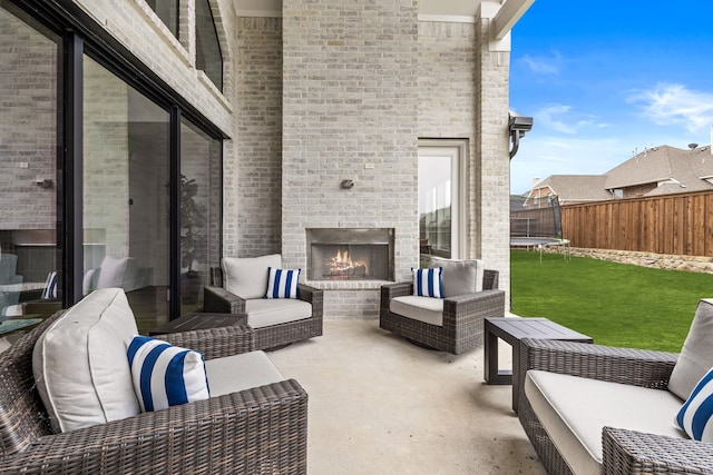 1733 Cousins Trl, Frisco, TX 75034 - view of patio with a trampoline and an outdoor living space with a fireplace