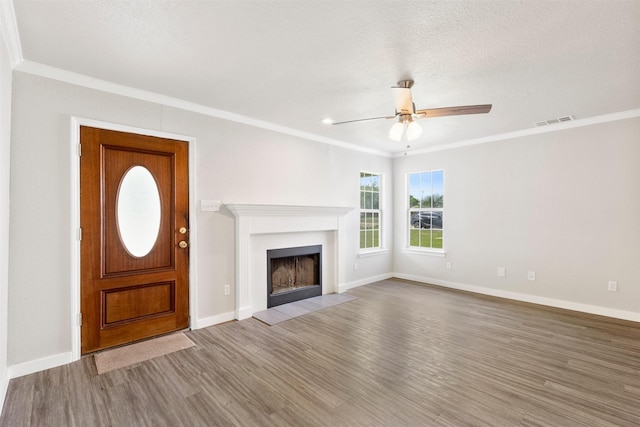 5937 Boone St, Sachse, TX 75048 - unfurnished living room featuring crown molding, ceiling fan, wood finished floors, and a fireplace with flush hearth