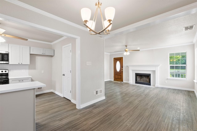 5937 Boone St, Sachse, TX 75048 - kitchen with ceiling fan, stainless steel microwave, light countertops, electric range, and wood finished floors