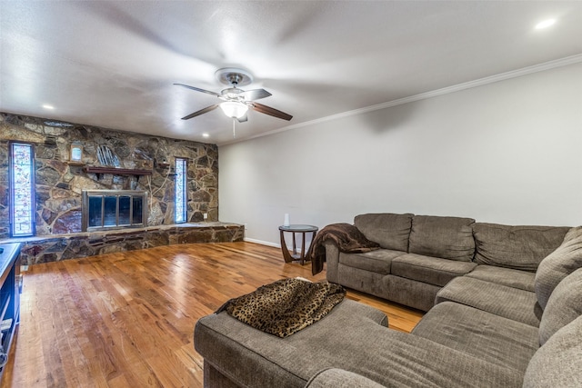 2029 Aloha Dr, Mesquite, TX 75150 - living room with a ceiling fan, wood finished floors, crown molding, baseboards, and a fireplace