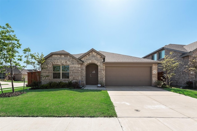 3615 Big Nemaha Dr, Crandall, TX 75114 - french provincial home with an attached garage, driveway, a front lawn, stone siding, and a shingled roof