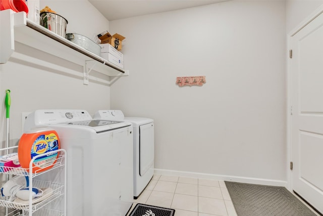 3615 Big Nemaha Dr, Crandall, TX 75114 - laundry area featuring washer and clothes dryer, baseboards, and light tile patterned flooring
