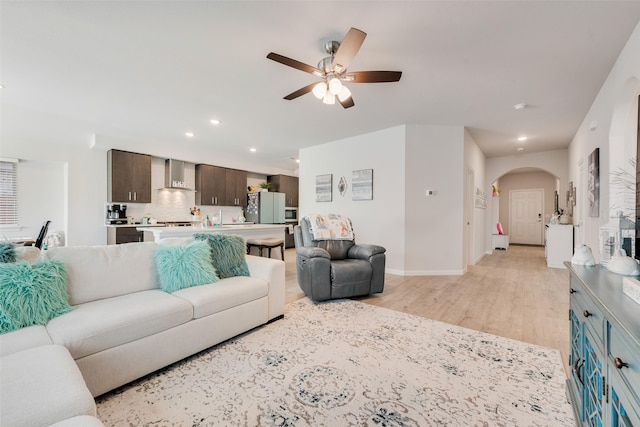3615 Big Nemaha Dr, Crandall, TX 75114 - living area with ceiling fan, light wood-type flooring, recessed lighting, arched walkways, and baseboards