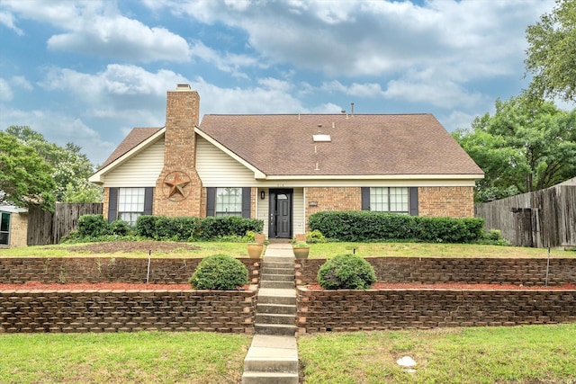 818 Placid Dr, Mesquite, TX 75150 - view of front facade featuring brick siding, a chimney, and roof with shingles