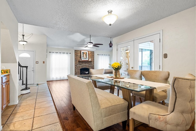 818 Placid Dr, Mesquite, TX 75150 - dining room featuring a textured ceiling, plenty of natural light, a ceiling fan, and light wood-style flooring