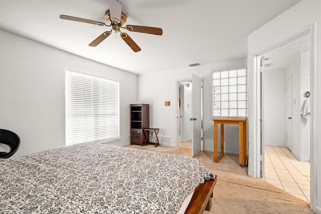 818 Placid Dr, Mesquite, TX 75150 - bedroom with a ceiling fan and light tile patterned floors
