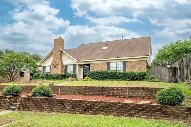 818 Placid Dr, Mesquite, TX 75150 - view of front of house featuring brick siding, a chimney, and roof with shingles