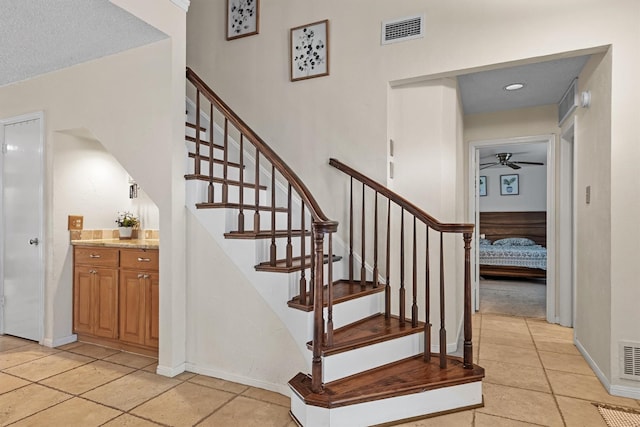 818 Placid Dr, Mesquite, TX 75150 - stairway with a ceiling fan, baseboards, and tile patterned flooring