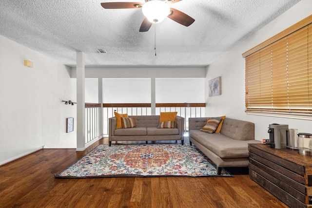 818 Placid Dr, Mesquite, TX 75150 - living room featuring a textured ceiling, wood finished floors, and ceiling fan