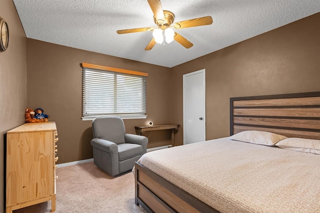 818 Placid Dr, Mesquite, TX 75150 - bedroom with light colored carpet, a textured ceiling, baseboards, and a ceiling fan