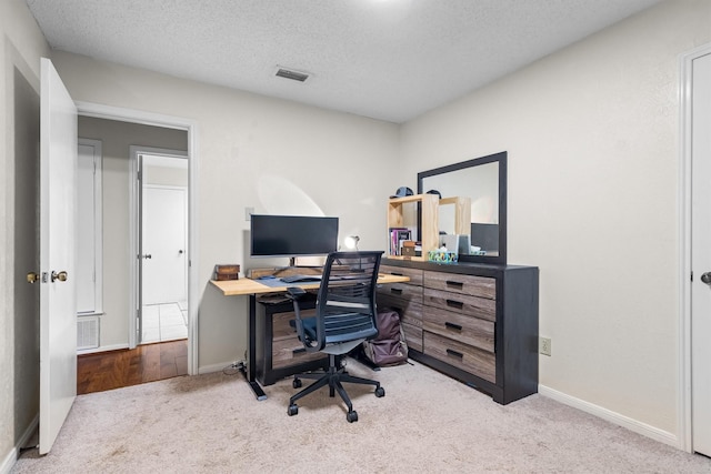 818 Placid Dr, Mesquite, TX 75150 - carpeted office space featuring baseboards and a textured ceiling