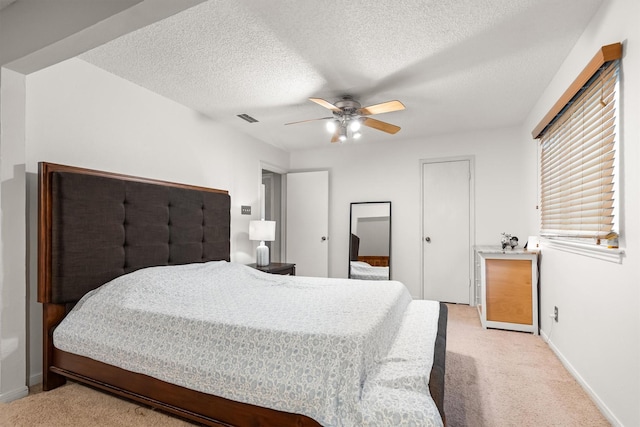 818 Placid Dr, Mesquite, TX 75150 - bedroom featuring light colored carpet, baseboards, a textured ceiling, and ceiling fan