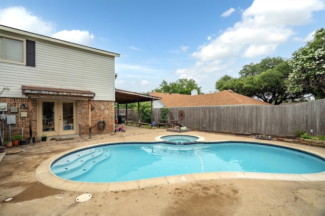 818 Placid Dr, Mesquite, TX 75150 - view of pool with french doors, a fenced backyard, a patio area, and a pool with connected hot tub