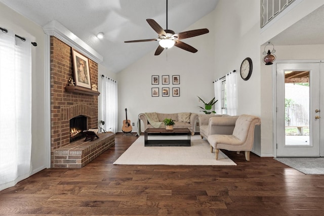 818 Placid Dr, Mesquite, TX 75150 - living area with ceiling fan, a fireplace, dark wood-type flooring, and high vaulted ceiling