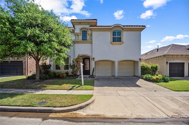 2504 Las Palmas Ln, Plano, TX 75075 - mediterranean / spanish home with a garage, concrete driveway, stucco siding, and a front lawn