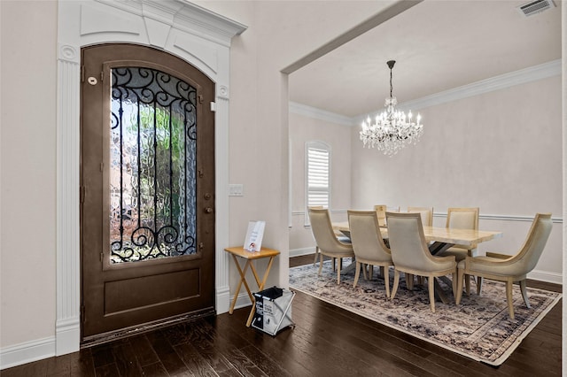 2504 Las Palmas Ln, Plano, TX 75075 - foyer entrance with a chandelier, plenty of natural light, dark wood finished floors, ornamental molding, and baseboards