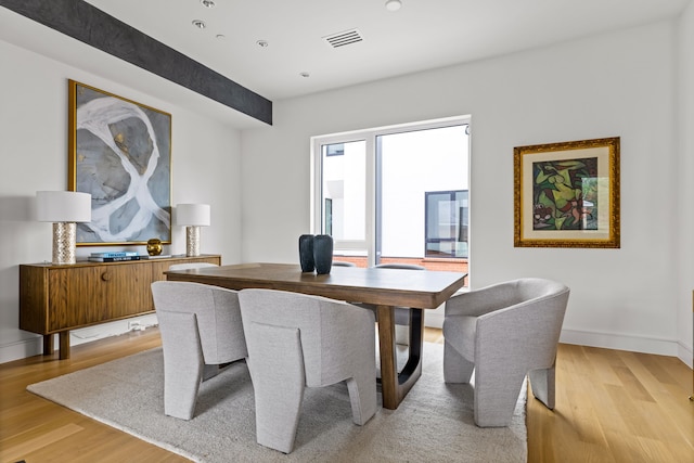 3909 Hawthorne Ave Unit 101, Dallas, TX 75219 - dining room featuring light wood-style flooring and baseboards