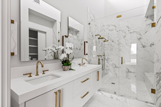 3909 Hawthorne Ave Unit 101, Dallas, TX 75219 - bathroom with a marble finish shower, double vanity, and marble finish floors
