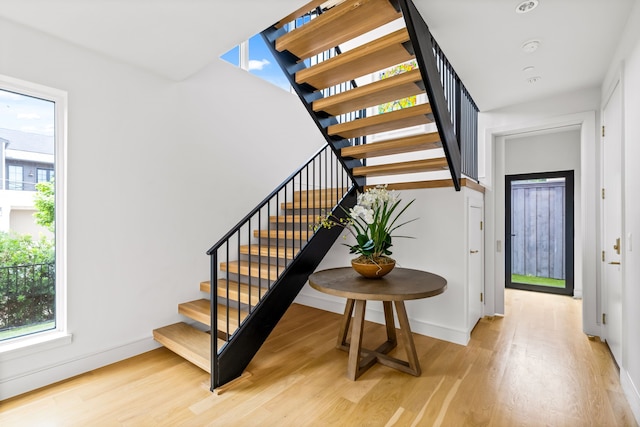 3909 Hawthorne Ave Unit 101, Dallas, TX 75219 - stairs featuring wood finished floors and baseboards