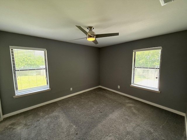 137 W 6th St, Krum, TX 76249 - spare room featuring plenty of natural light, baseboards, and dark colored carpet