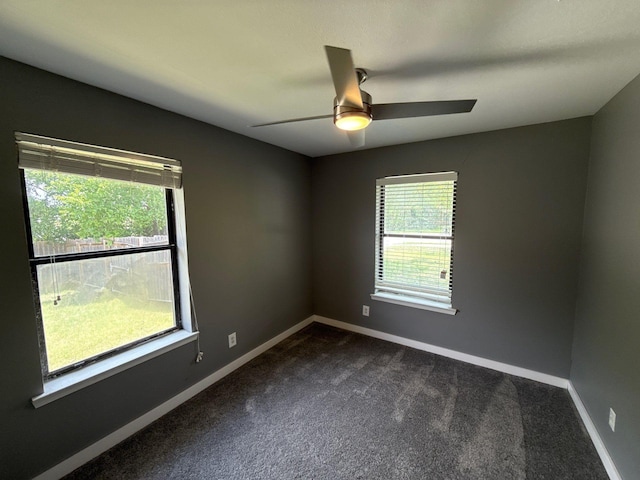 137 W 6th St, Krum, TX 76249 - spare room with plenty of natural light, a ceiling fan, and dark carpet