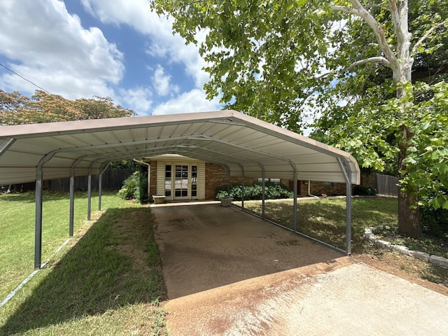 137 W 6th St, Krum, TX 76249 - view of parking featuring a carport, concrete driveway, and french doors