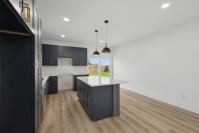 3923 Le May Ave, Dallas, TX 75216 - kitchen featuring recessed lighting, light wood-style flooring, tasteful backsplash, decorative light fixtures, and light countertops