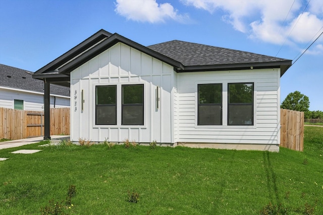 3923 Le May Ave, Dallas, TX 75216 - rear view of property with board and batten siding and roof with shingles