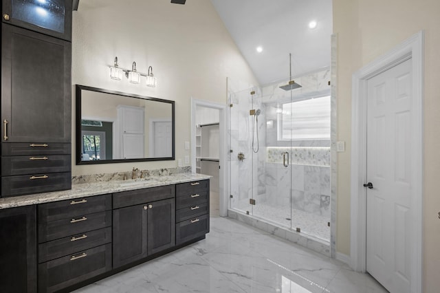 1002 Hidden Knoll Ct, Southlake, TX 76092 - bathroom featuring vanity, a marble finish shower, marble look tile flooring, recessed lighting, and high vaulted ceiling