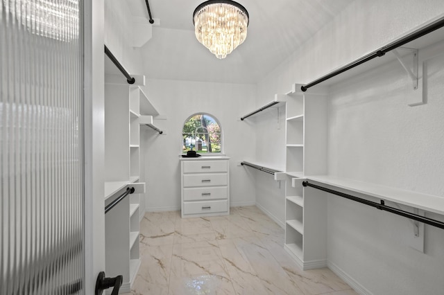 1002 Hidden Knoll Ct, Southlake, TX 76092 - walk in closet featuring light marble finish floors and a chandelier
