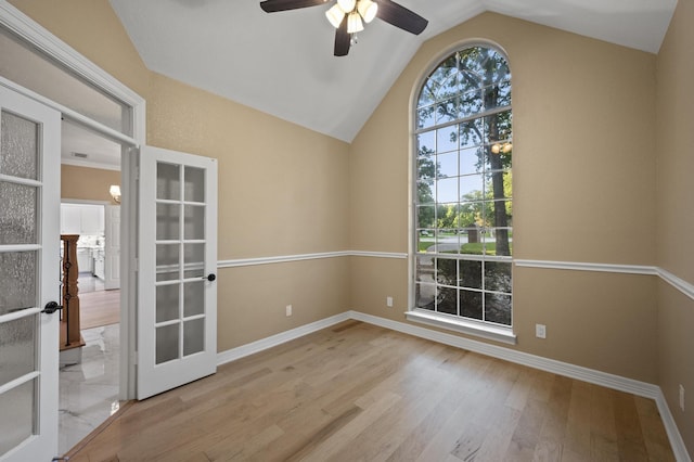 1002 Hidden Knoll Ct, Southlake, TX 76092 - empty room with french doors, a ceiling fan, wood finished floors, and lofted ceiling
