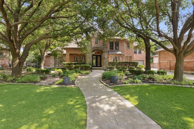 9922 Lakeway Ct, Dallas, TX 75230 - view of front of property featuring brick siding and a front yard