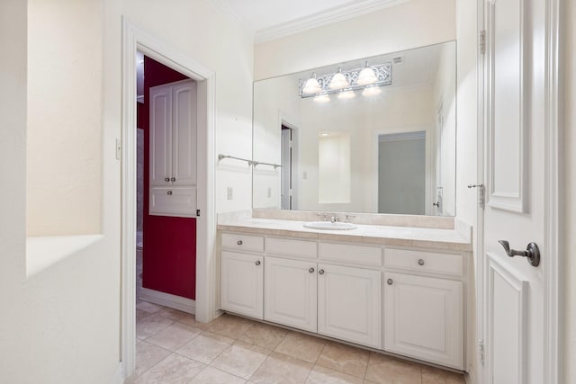 9922 Lakeway Ct, Dallas, TX 75230 - bathroom featuring vanity, ornamental molding, tile patterned floors, and baseboards