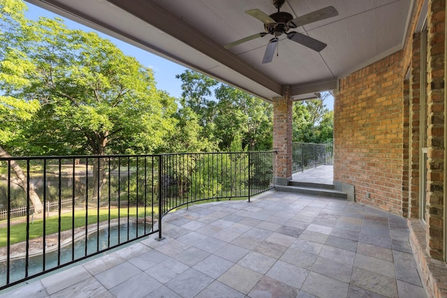 9922 Lakeway Ct, Dallas, TX 75230 - view of patio featuring a ceiling fan, a balcony, and view of wooded area