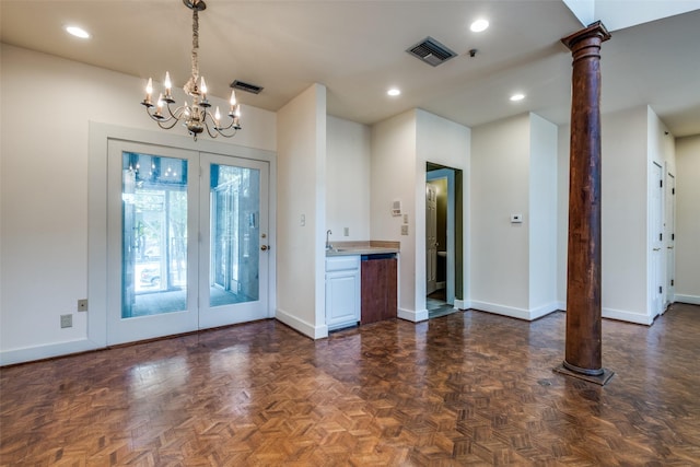905 Liberty St, Dallas, TX 75204 - entrance foyer with baseboards, a chandelier, recessed lighting, and decorative columns