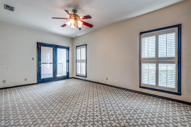 905 Liberty St, Dallas, TX 75204 - carpeted empty room featuring a ceiling fan and baseboards