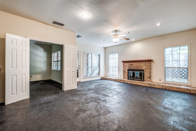905 Liberty St, Dallas, TX 75204 - unfurnished living room with unfinished concrete floors, a ceiling fan, a fireplace, and recessed lighting