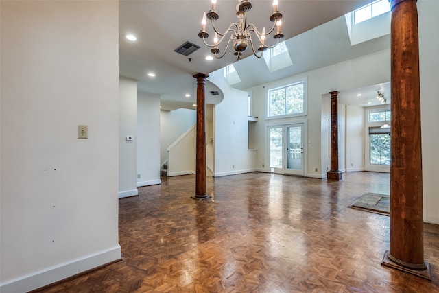 905 Liberty St, Dallas, TX 75204 - unfurnished living room with baseboards, a high ceiling, ornate columns, stairway, and recessed lighting