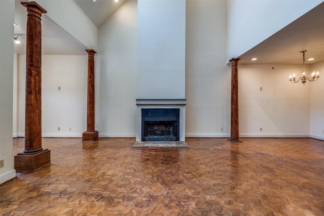 905 Liberty St, Dallas, TX 75204 - unfurnished living room featuring high vaulted ceiling, baseboards, a fireplace, decorative columns, and a chandelier