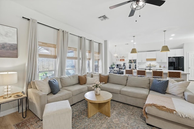 15429 Calico Ct, Frisco, TX 75035 - living area featuring ceiling fan and wood finished floors