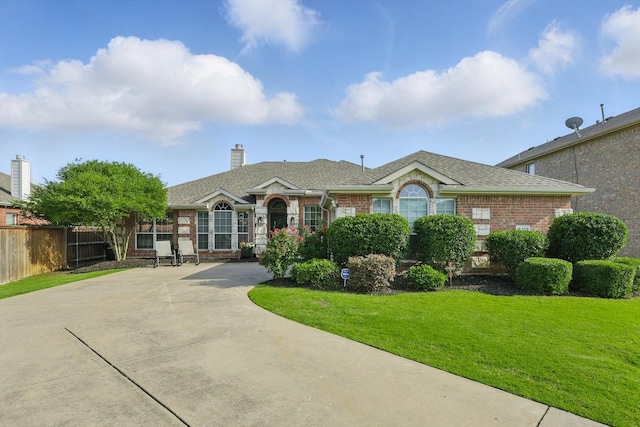 15429 Calico Ct, Frisco, TX 75035 - ranch-style house featuring brick siding, roof with shingles, and a chimney