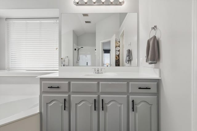 15429 Calico Ct, Frisco, TX 75035 - bathroom featuring vanity, a stall shower, and a bath