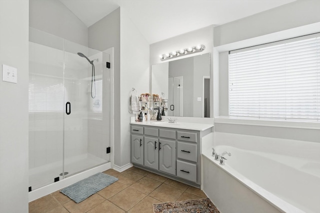 15429 Calico Ct, Frisco, TX 75035 - bathroom with a stall shower, vanity, a bath, tile patterned floors, and vaulted ceiling