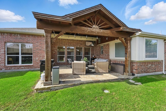 15429 Calico Ct, Frisco, TX 75035 - back of property featuring brick siding, a patio area, and a lawn
